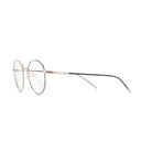 Lunettes anti lumière bleue rondes aux branches marrons, en métal argenté, de profil gauche sur fond blanc.
